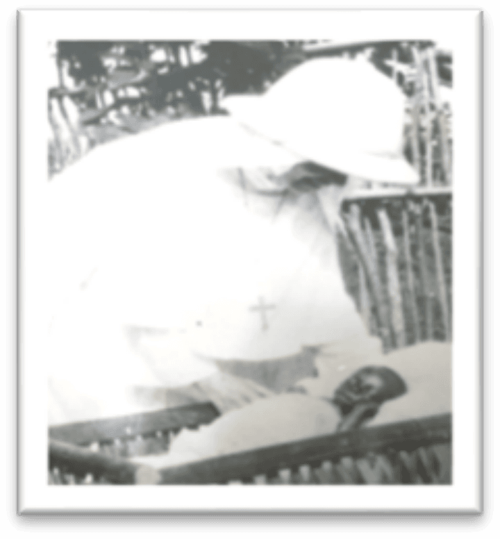 Mother Mary Edith, SHCJ, caring for a baby orphan